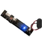 An integrated electronic circuit board with a battery, LED indicator, and various components for paintball equipment.