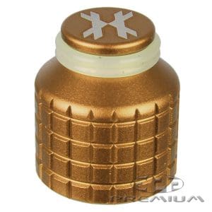 Gold-colored paintball barrel cover with textured grip and logo on top, designed for protection and style during paintball games.